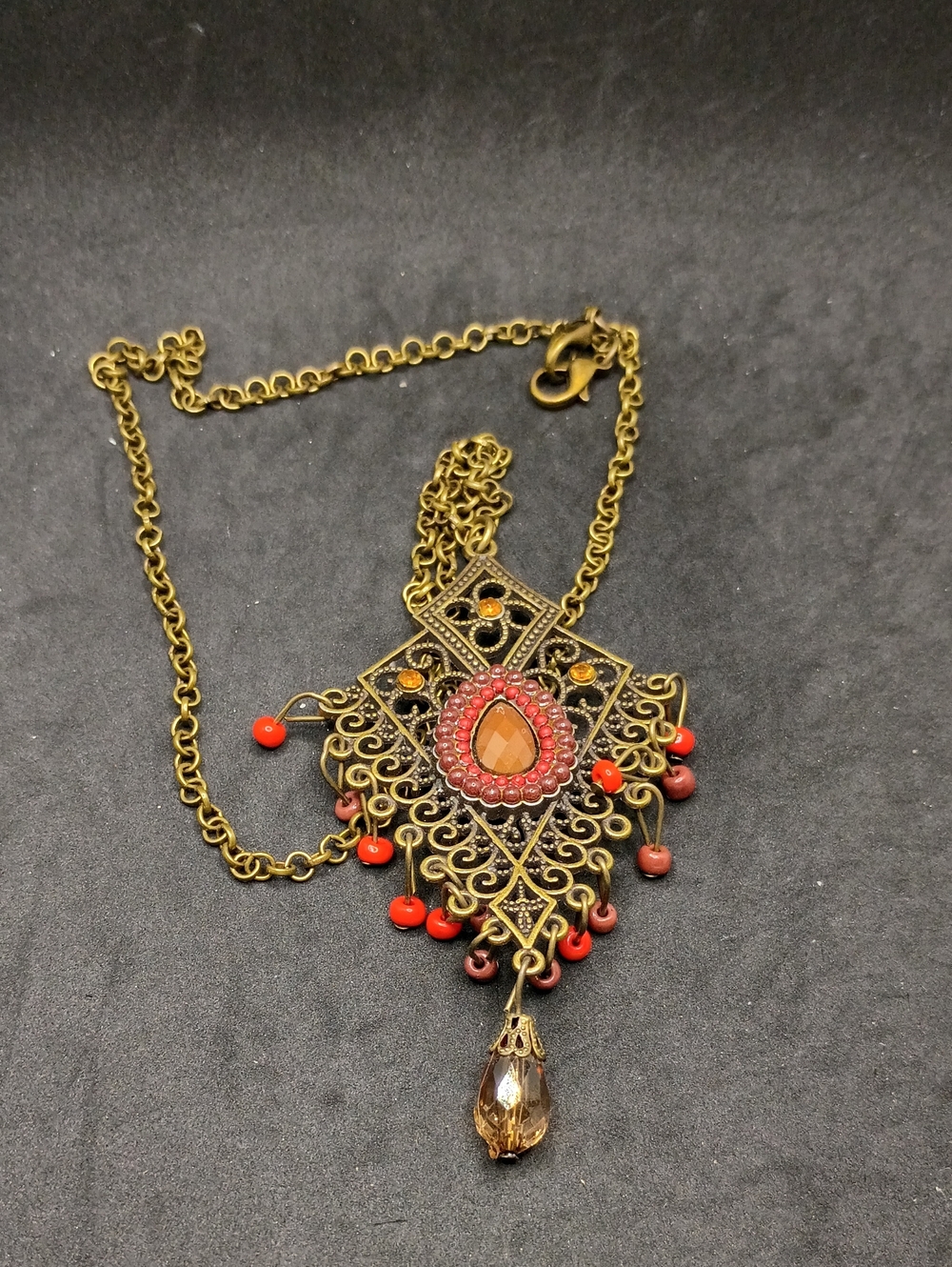 Vintage-Inspired Gold Filigree Pendant Necklace with Coral Beads
